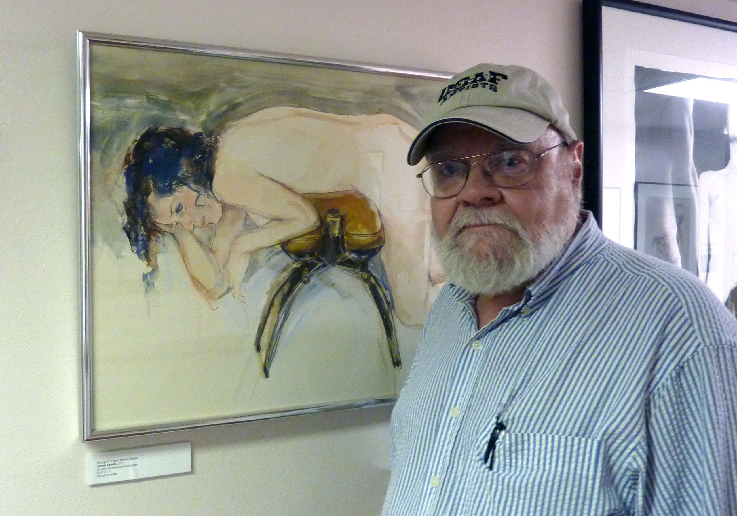 Clark with his painting CAMEL SADDLE in the gallery of the Kinsey Institute exhibition “New Acquisitions” in July of 1913